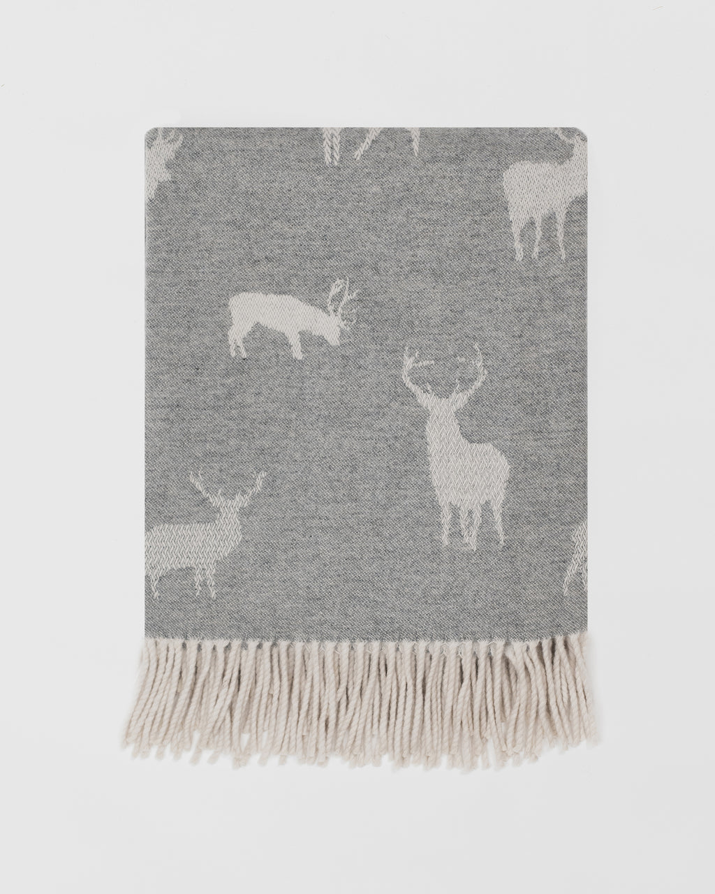 Remony nature stag grey blanket with deer pattern and white fringe on a light grey background
