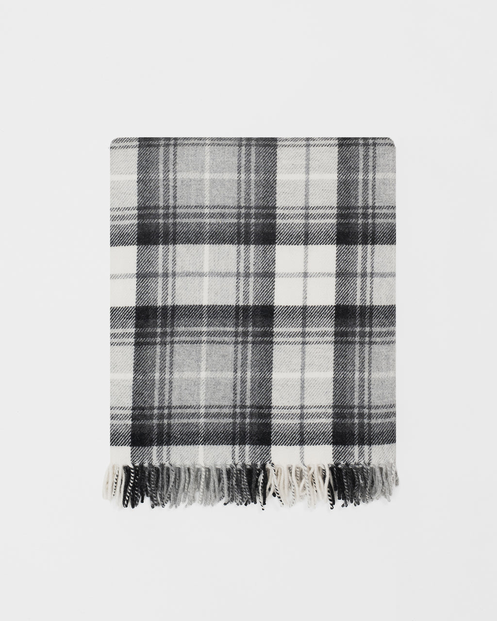 Remony Lindores slate throw - Plaid blanket with black and white pattern on a light gray background