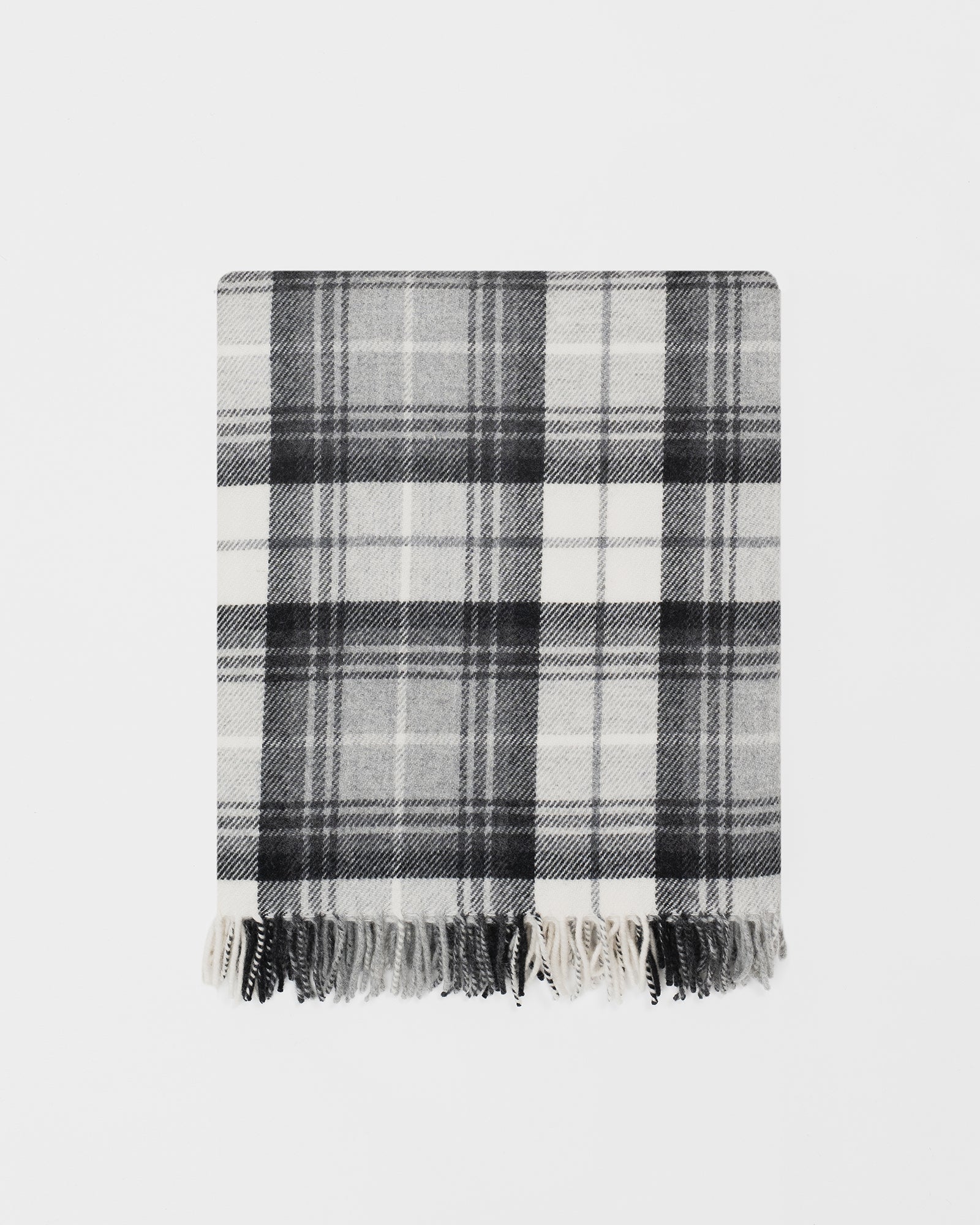 Remony Lindores slate throw - Plaid blanket with black and white pattern on a light gray background