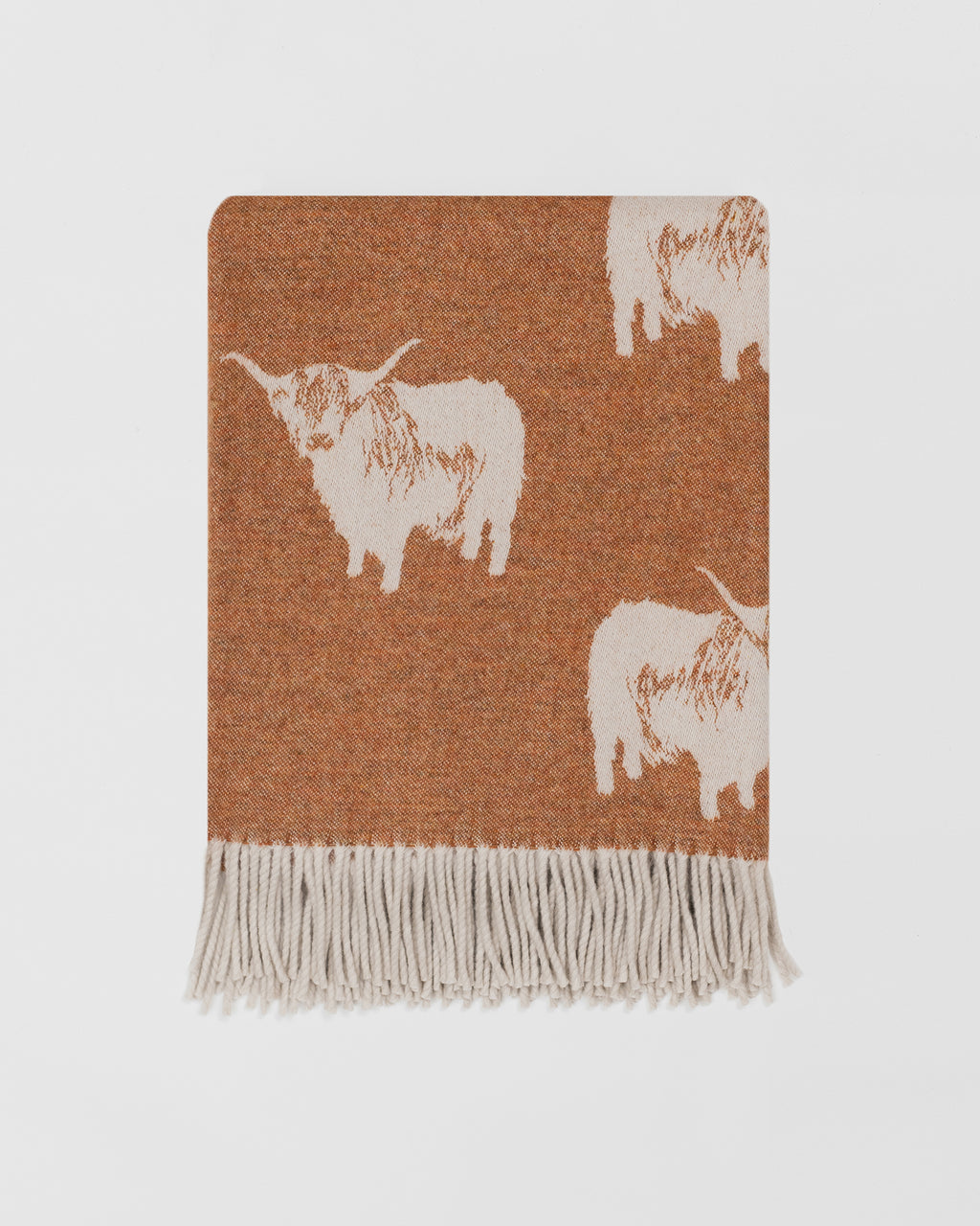 Remony nature highland cow rust throw - Woven blanket with white highland cow pattern on a brown background