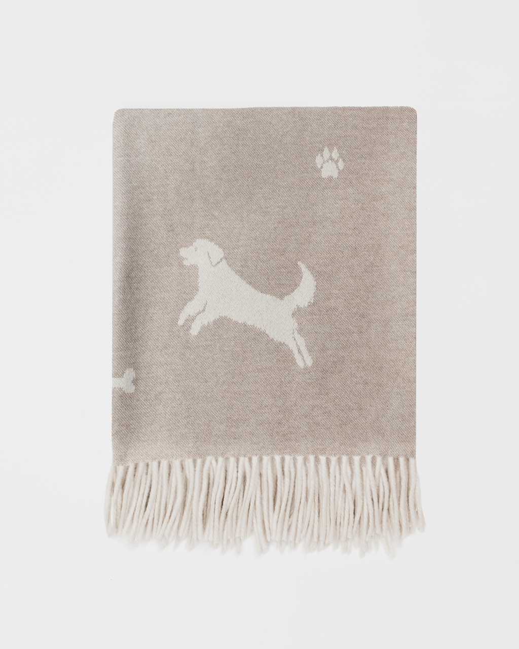 Fawn blanket with white multi dog pattern on white background