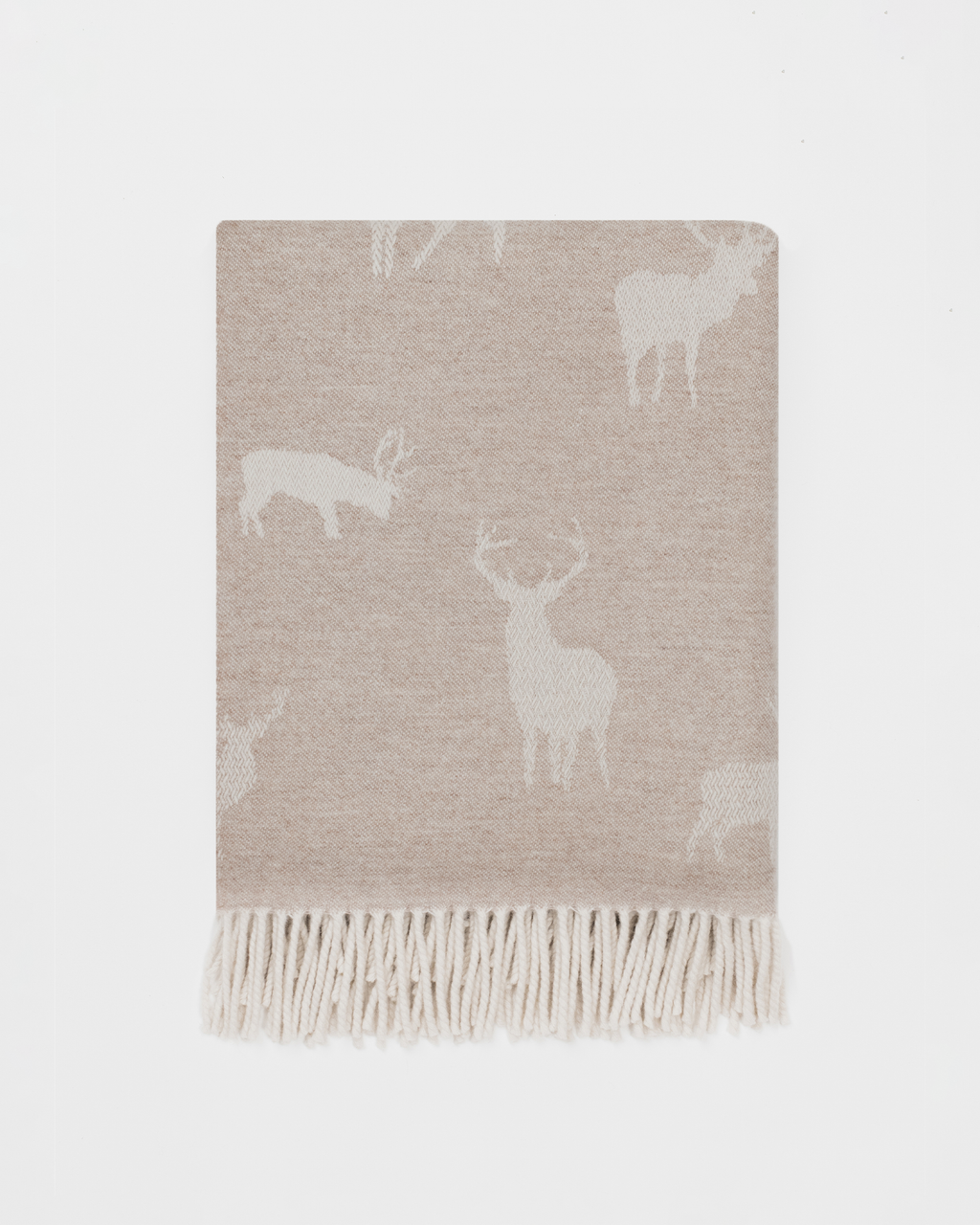 Beige blanket with deer pattern on a light gray background