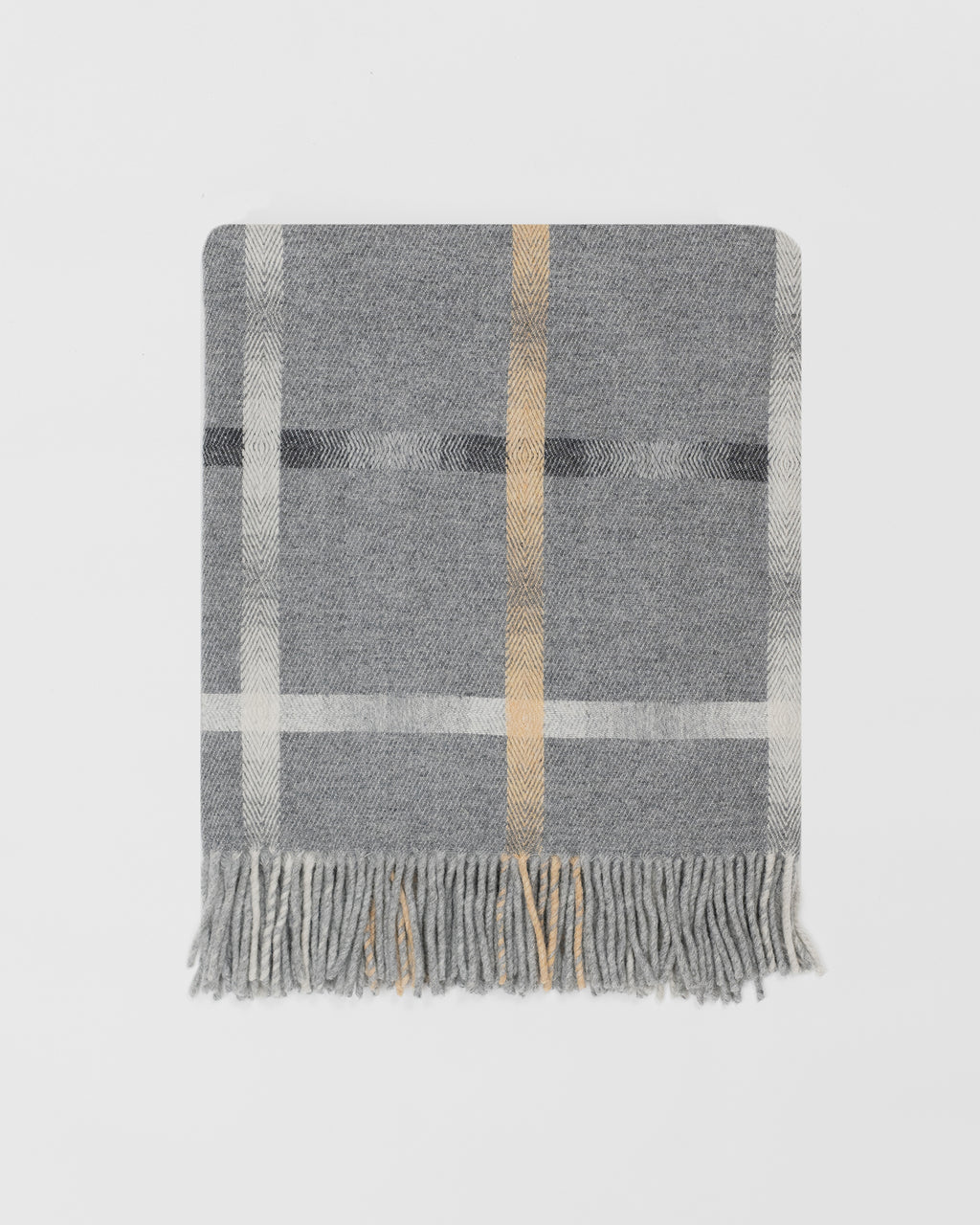Remony maree mist throw - checkered blanket with fringes on a light gray background