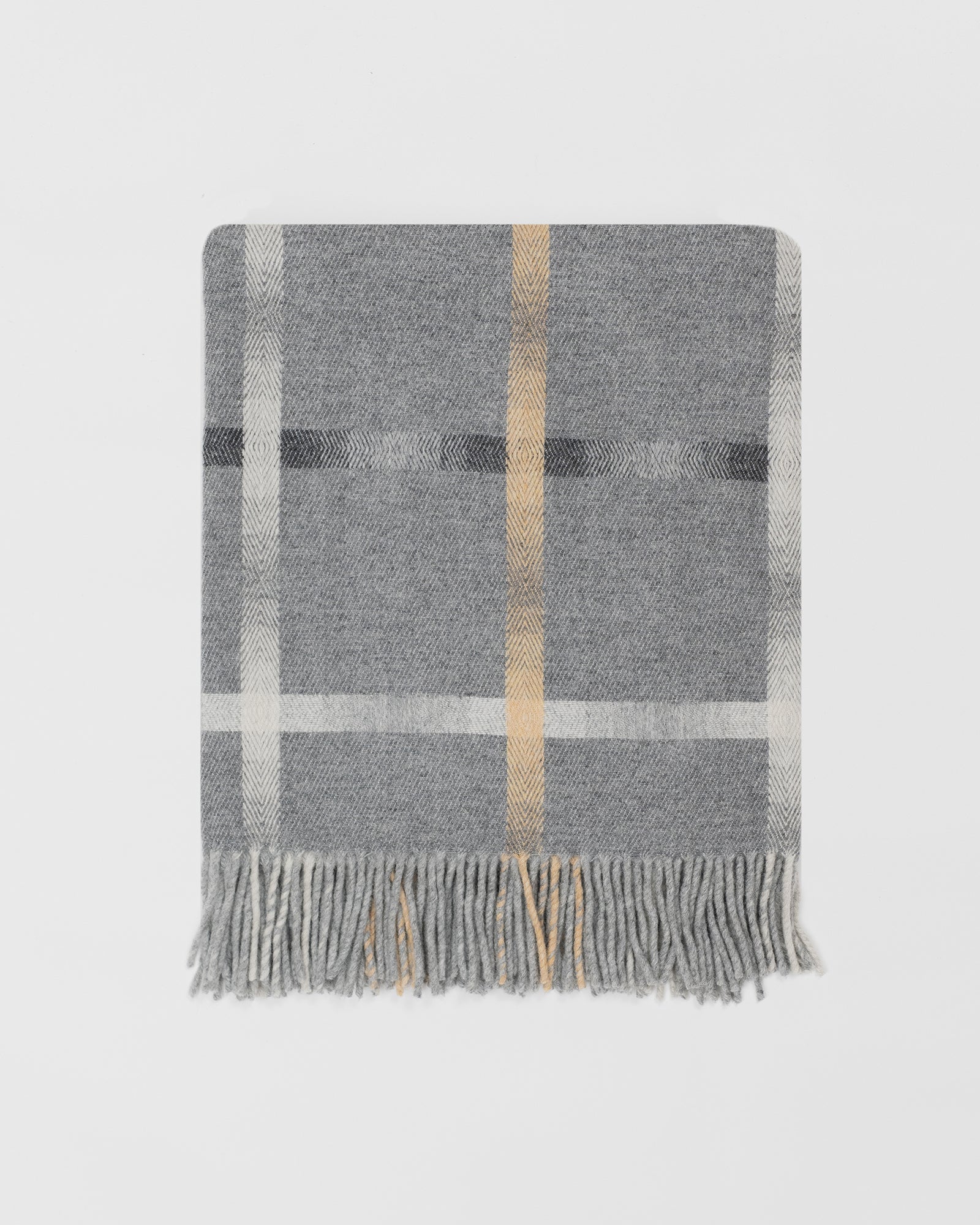 Remony maree mist throw - checkered blanket with fringes on a light gray background