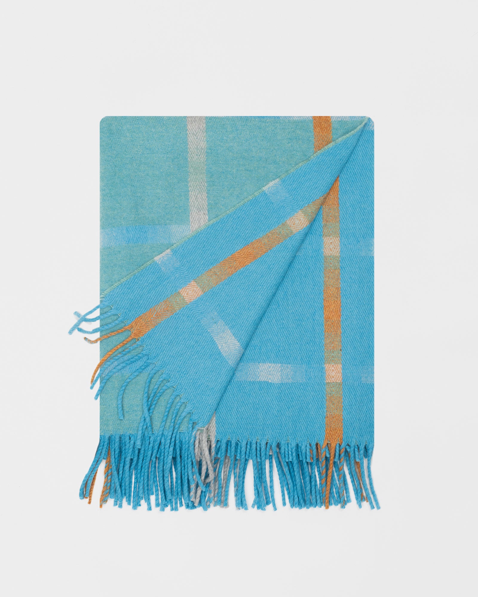 Remony maree jade throw - check blanket with fringes on a light gray background