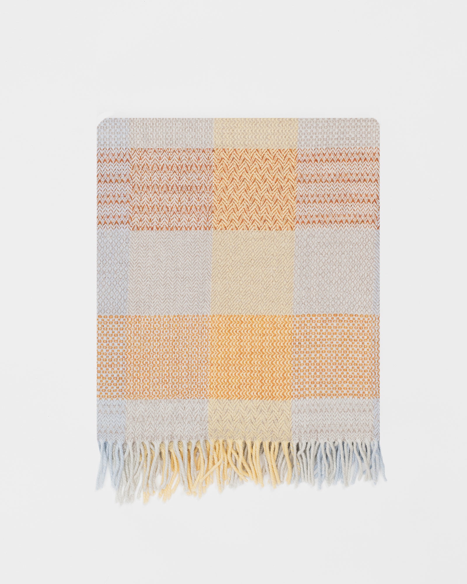 Remony Patchwork sunshine throw -  blanket with a checkered pattern in orange, yellow, and gray on a white background