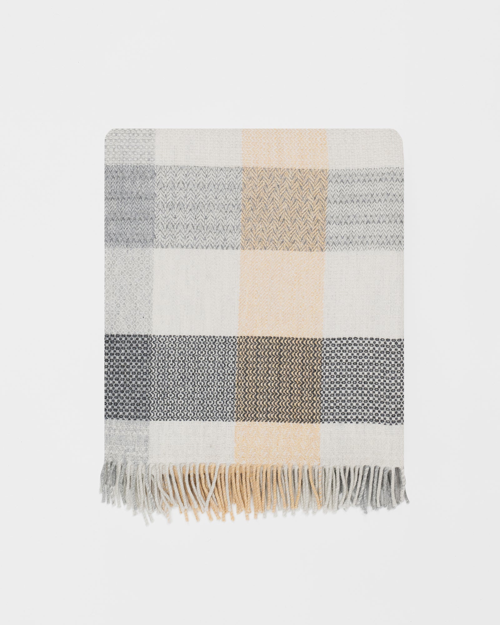 Remony patchwork croft throw - blanket with beige, gray, and white colors on a light gray background