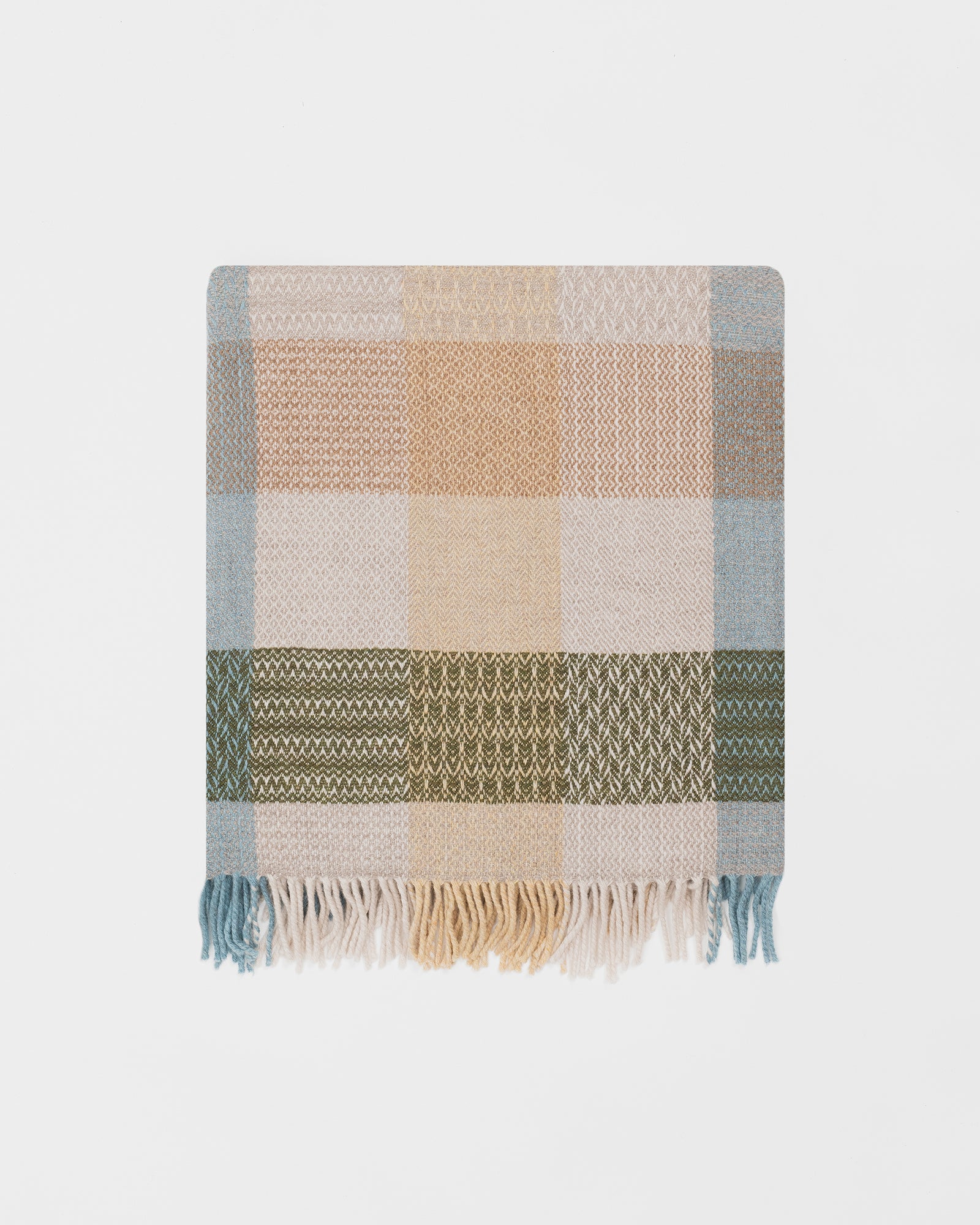 Remony patchwork hayloft throw - blanket with a checkered pattern on a light gray background