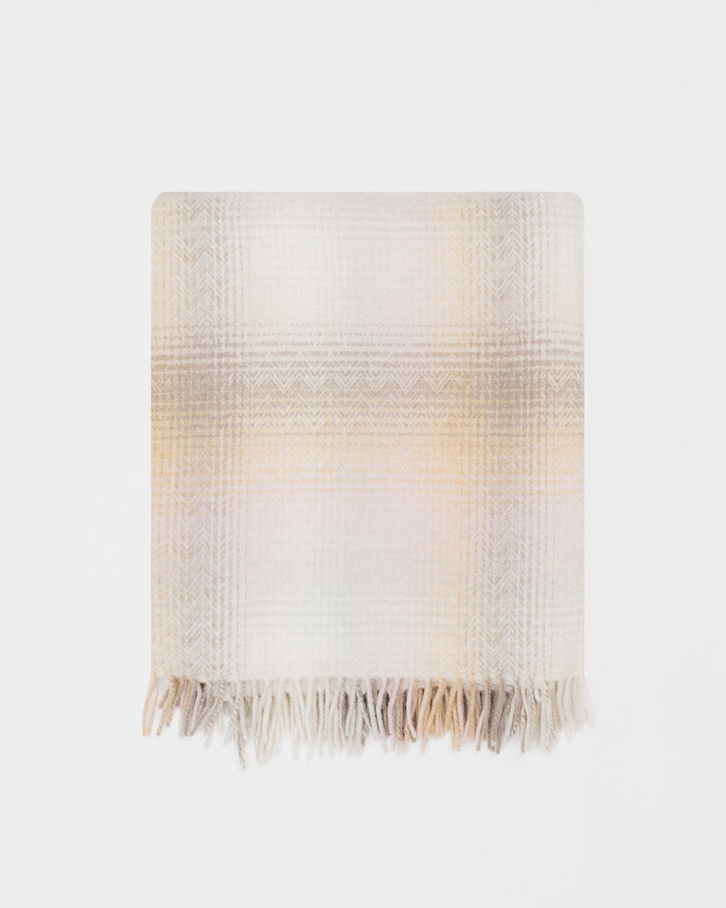 Remony lunan sands throw - Gradient blanket with fringes on a white background