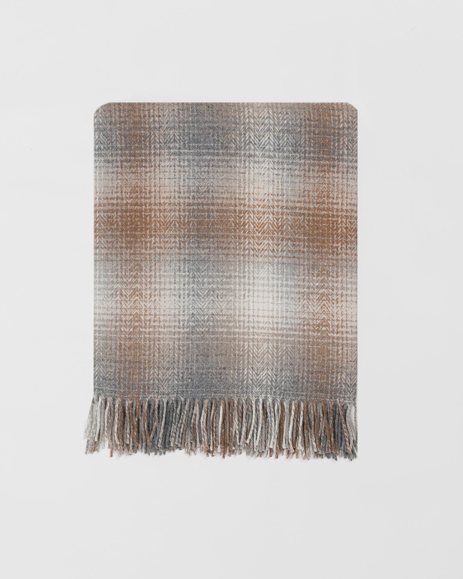 Remony bracken throw - Woven blanket with fringes on a light gray background