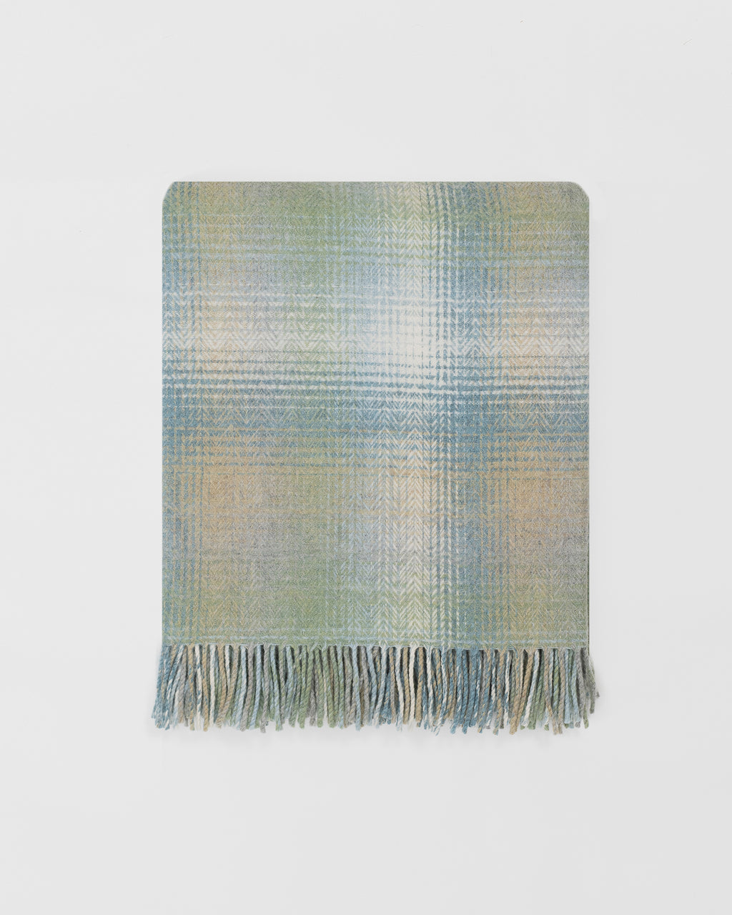 Remony lunan meadow throw - Plaid blanket with fringes on a light gray background