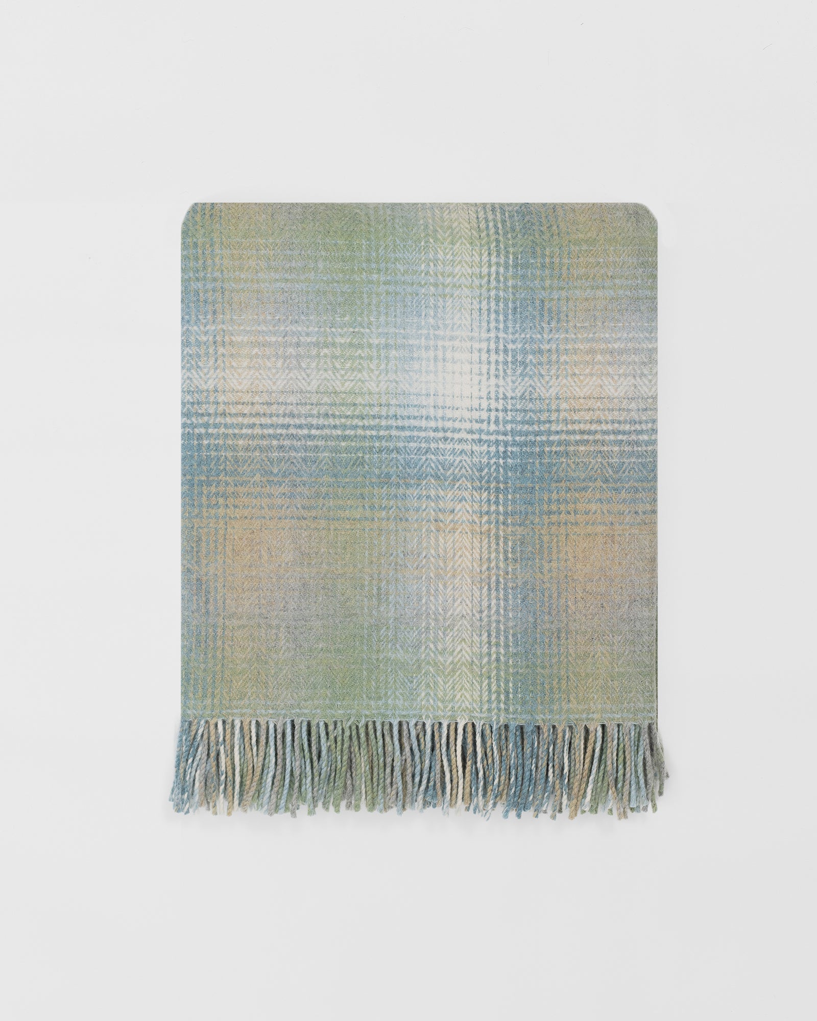 Remony lunan meadow throw - Plaid blanket with fringes on a light gray background