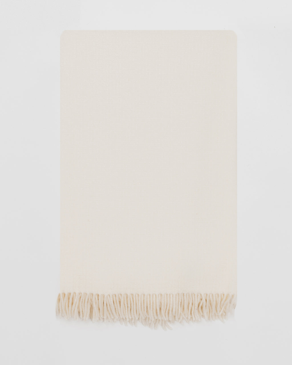 Remony clova snowcap throw - white blanket with fringes on a white background