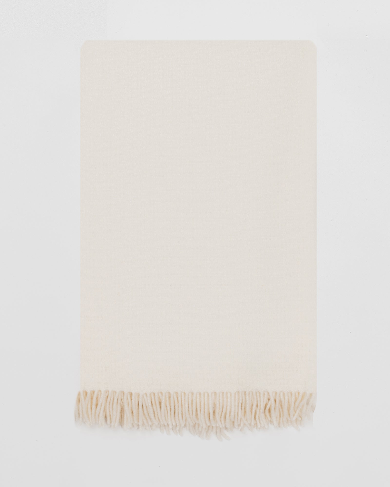 Remony clova snowcap throw - white blanket with fringes on a white background