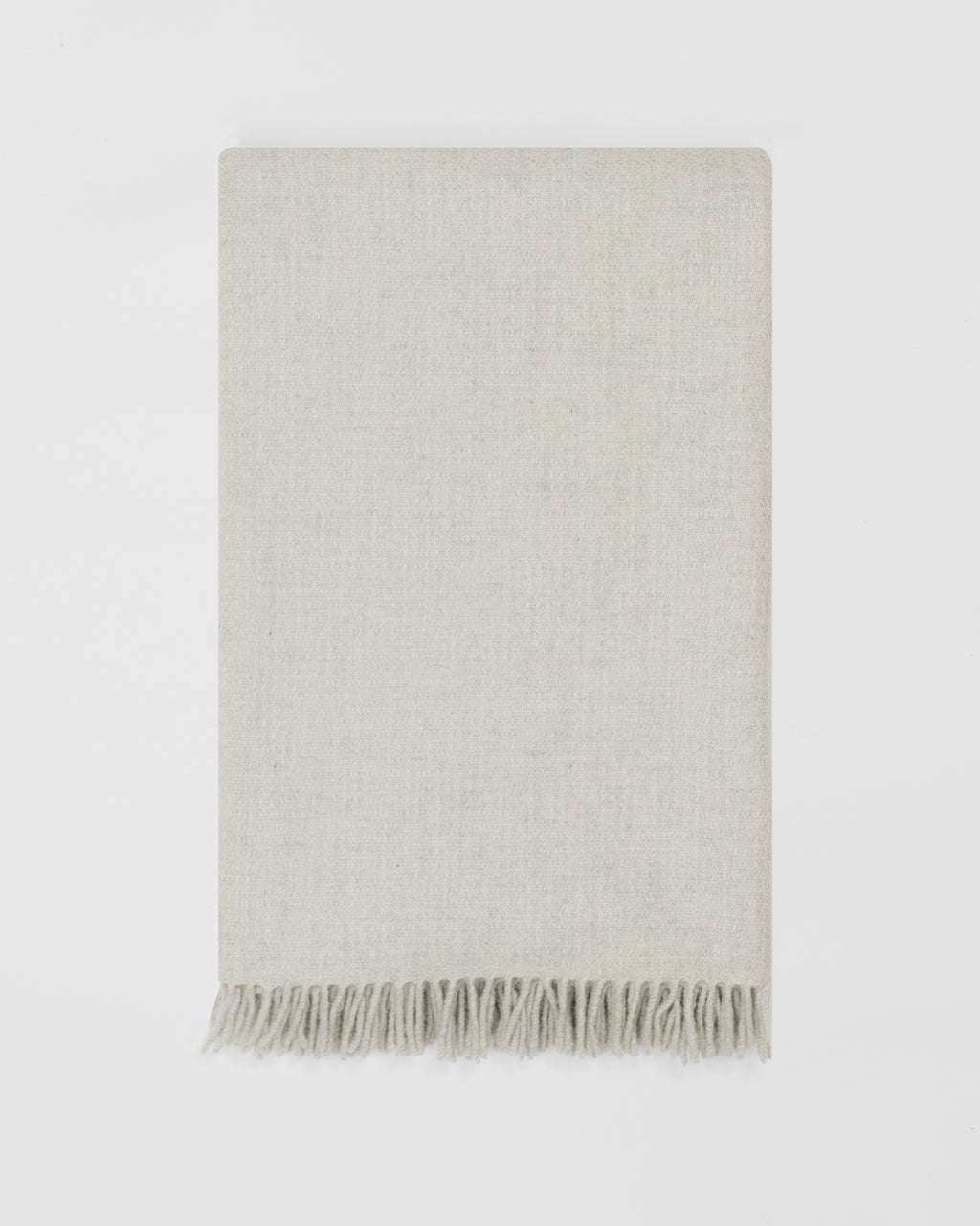 Remony clova stone large throw - woven blanket with fringes on a white background