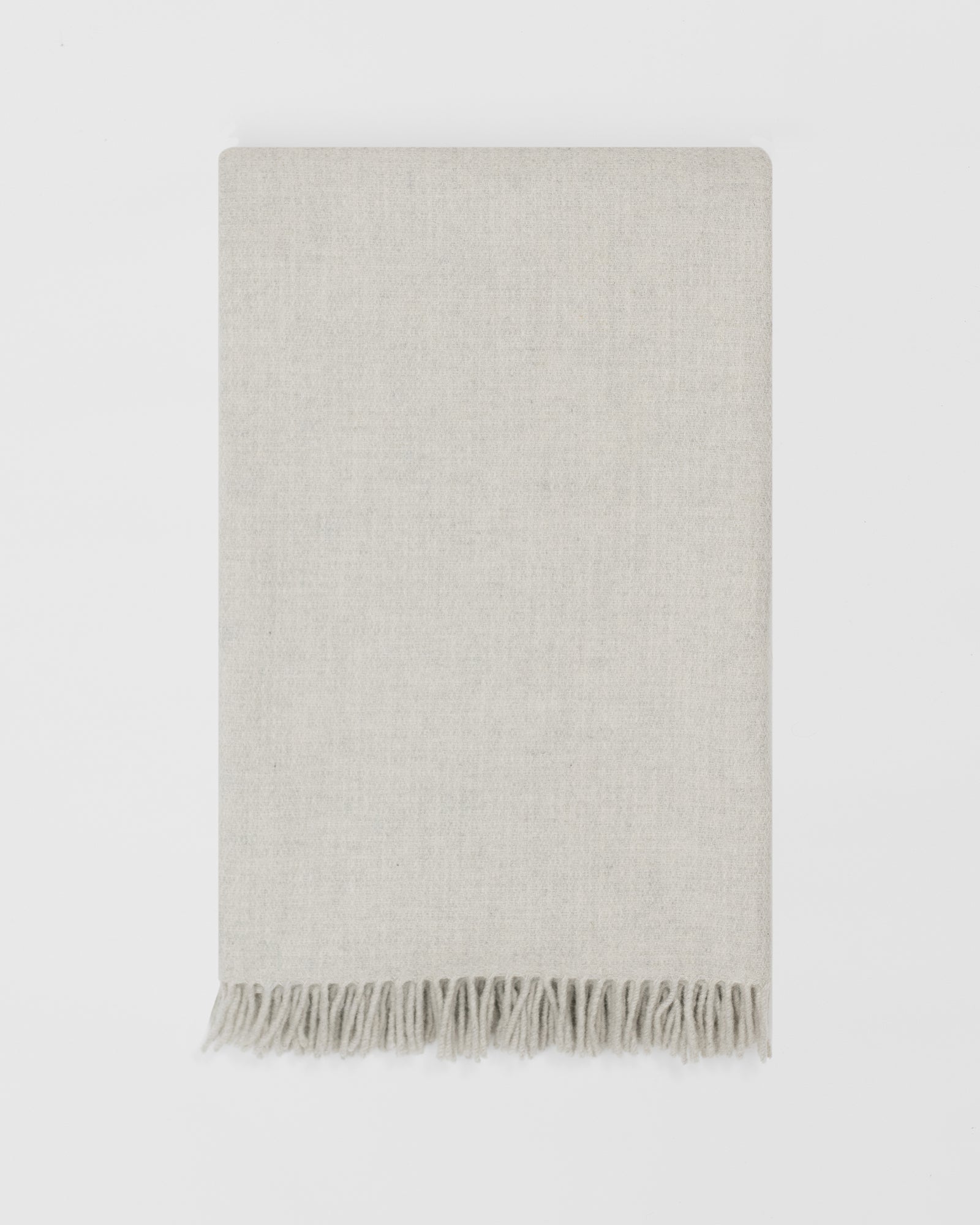 Remony clova stone large throw - woven blanket with fringes on a white background