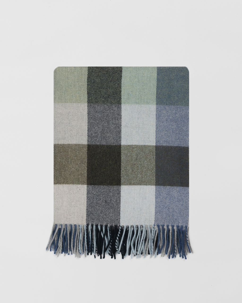 Remony dunira topaz throw - Plaid blanket with fringes on a light gray background