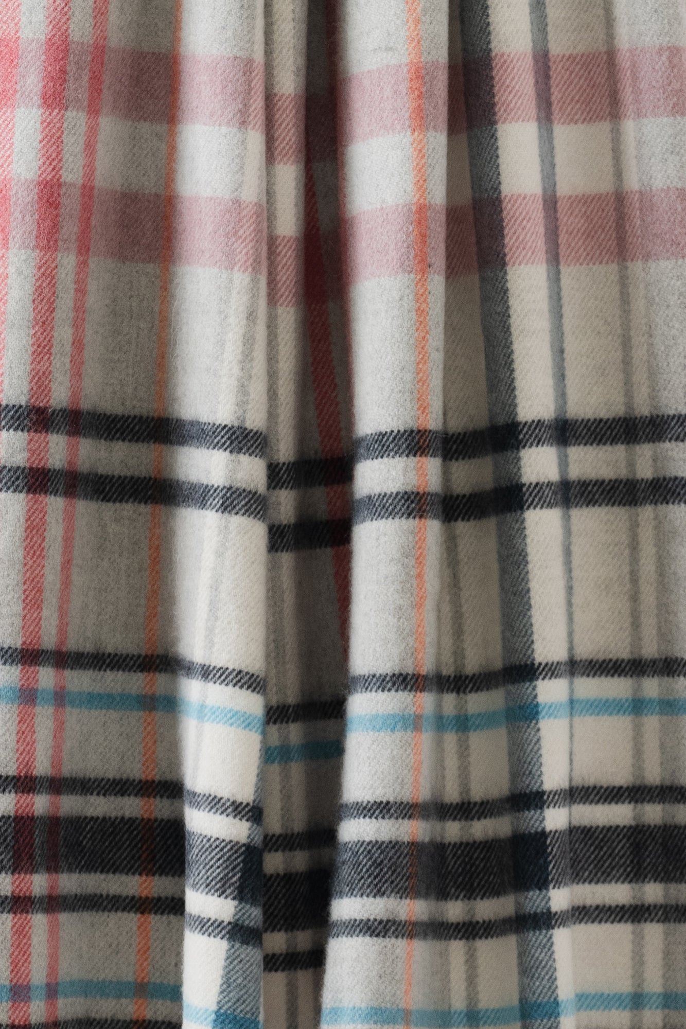 Remony Pitnacree Rose Stole - Close-up of plaid fabric with red, blue, and black patterns.