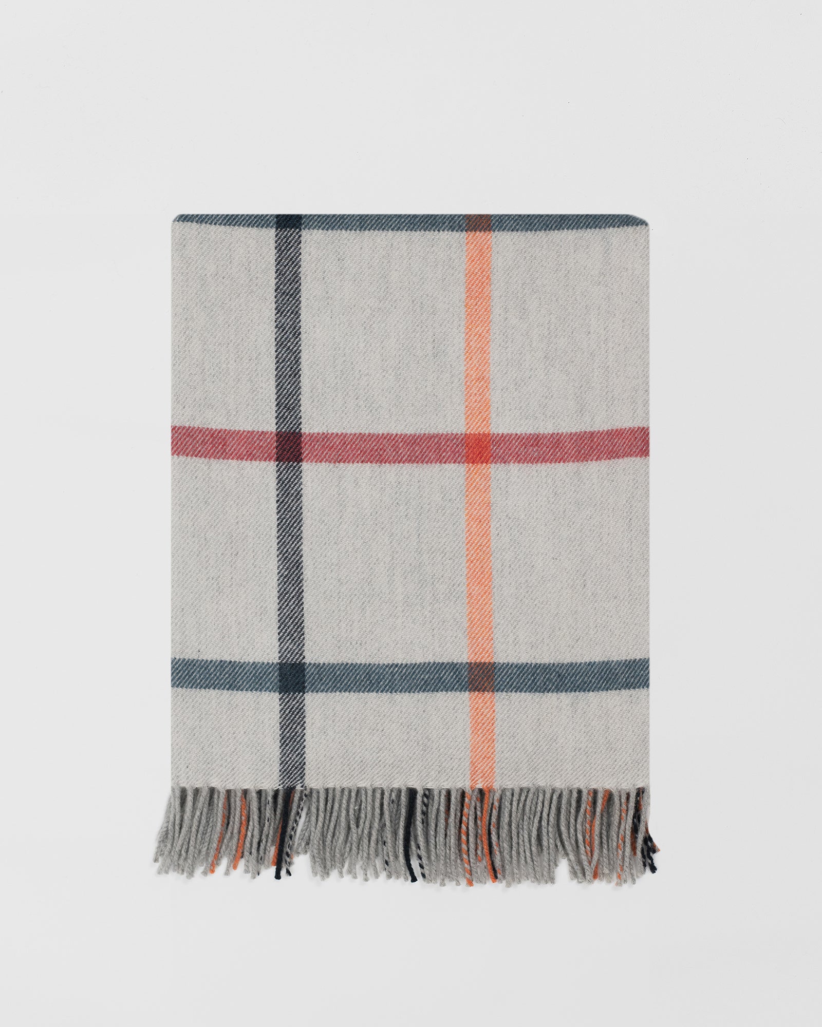 Remony milton melba throw - Plaid blanket with fringe on a light gray background