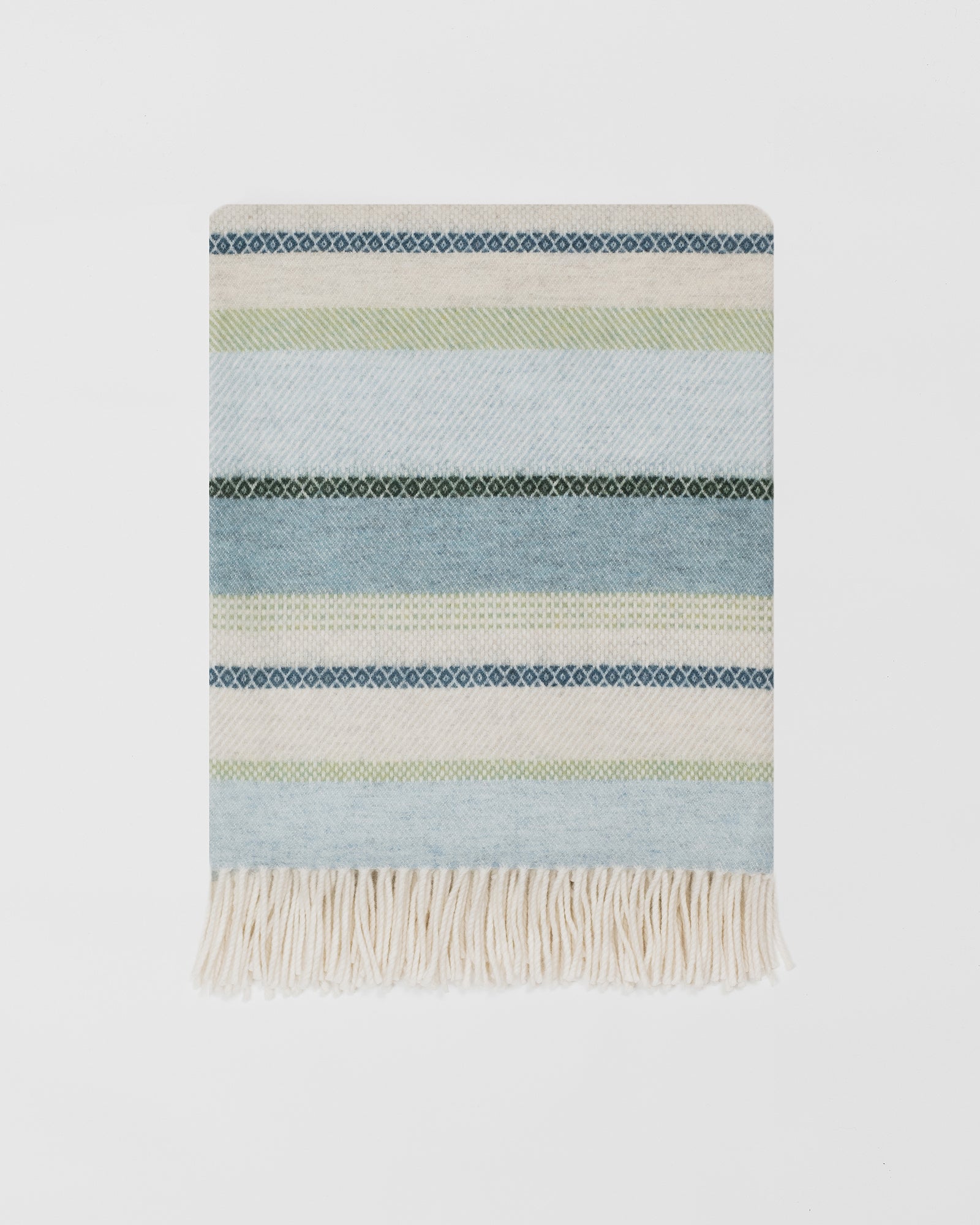 Remony croftmore seaglass throw - Striped woven blanket with fringes on a light gray background