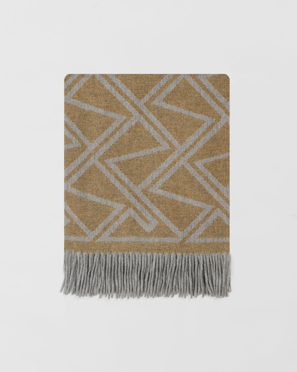 Remony fortriu mead throw - geometric patterned throw blanket with fringes on a light gray background