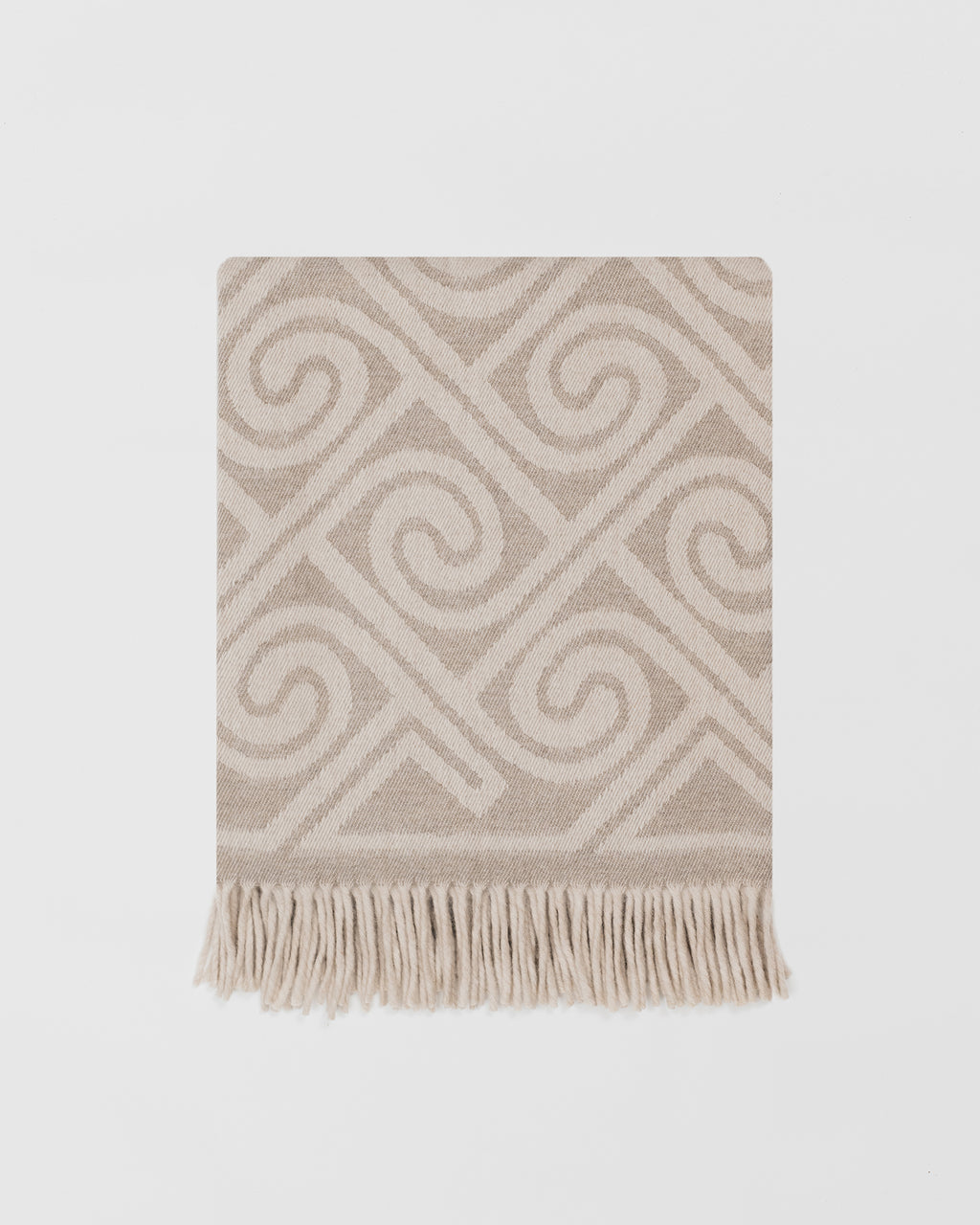Remony fortriu stone throw - Beige and white patterned throw blanket with fringes on a light gray background