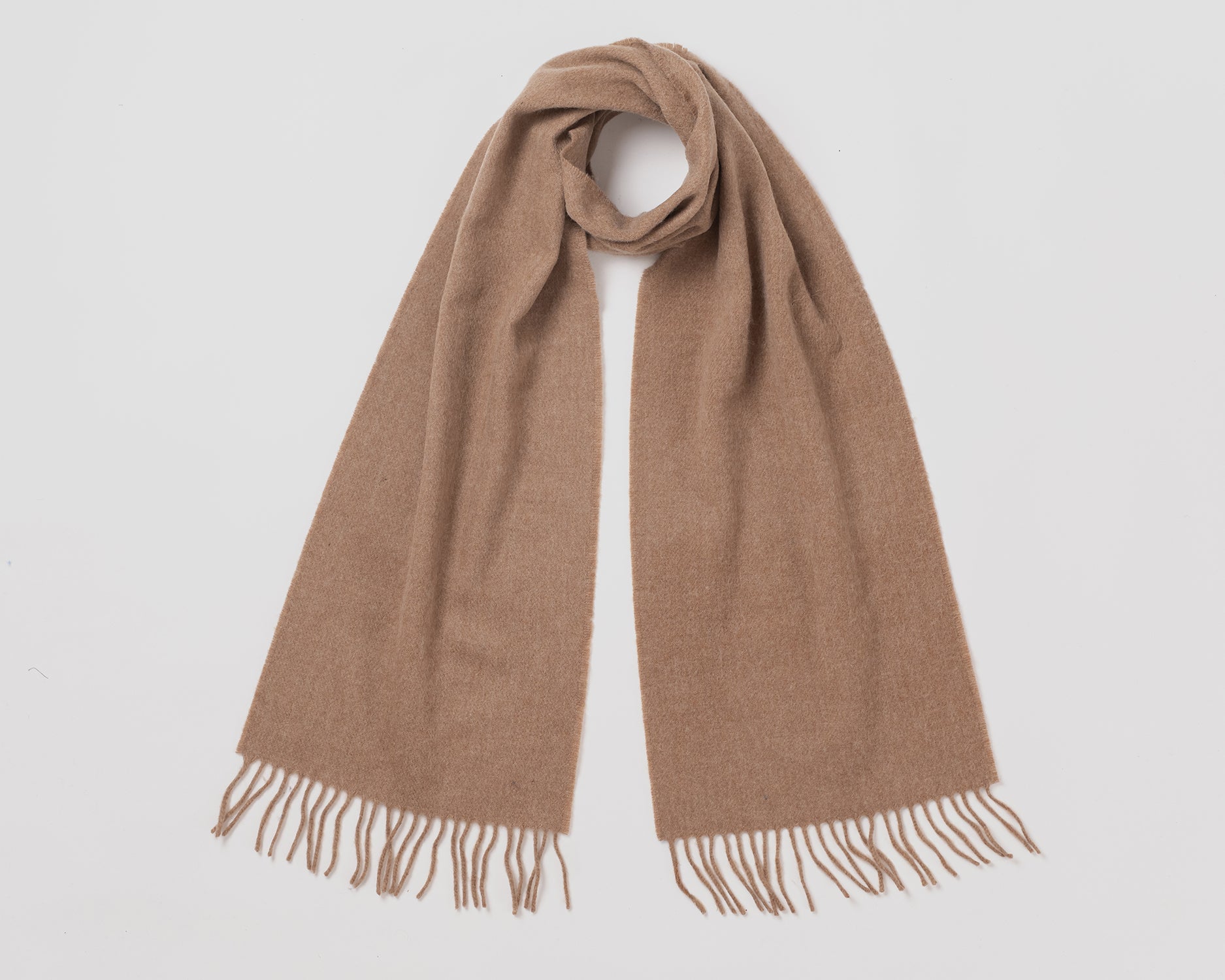 MacN plain camel scarf with fringes on a light gray background