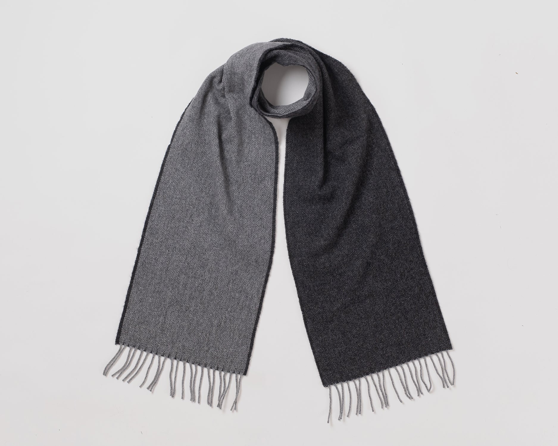 MacN Dual Charcoal/Grey scarf - Gray scarf with fringes on a light gray background